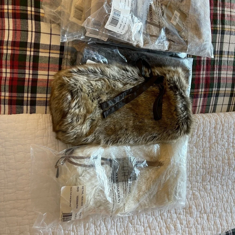 Pottery Barn Wine Bag in faux white fox Brand new and unused.